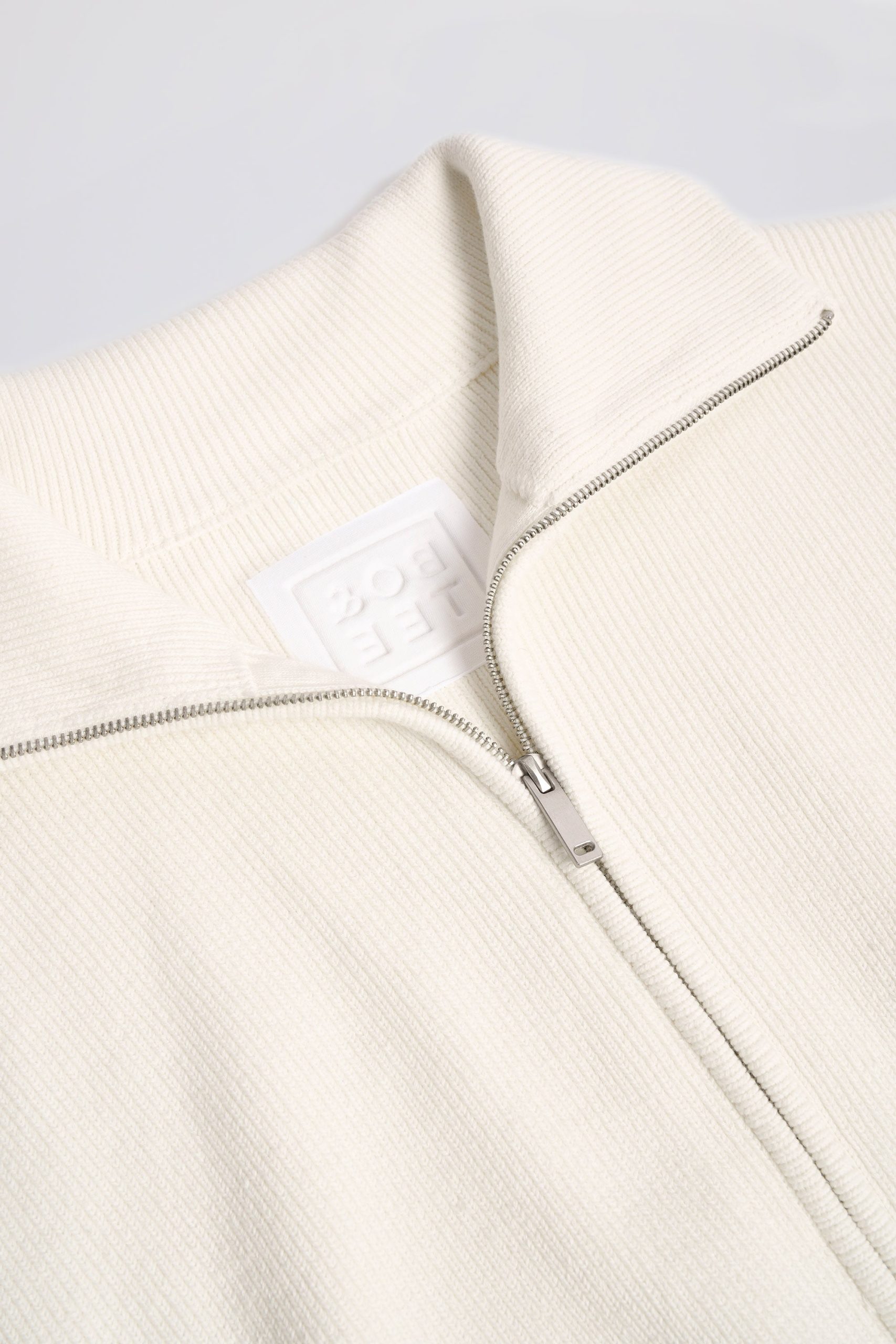 Ribbed Knit Zip-Up Cropped Sweatshirt in Ivory - Image 6