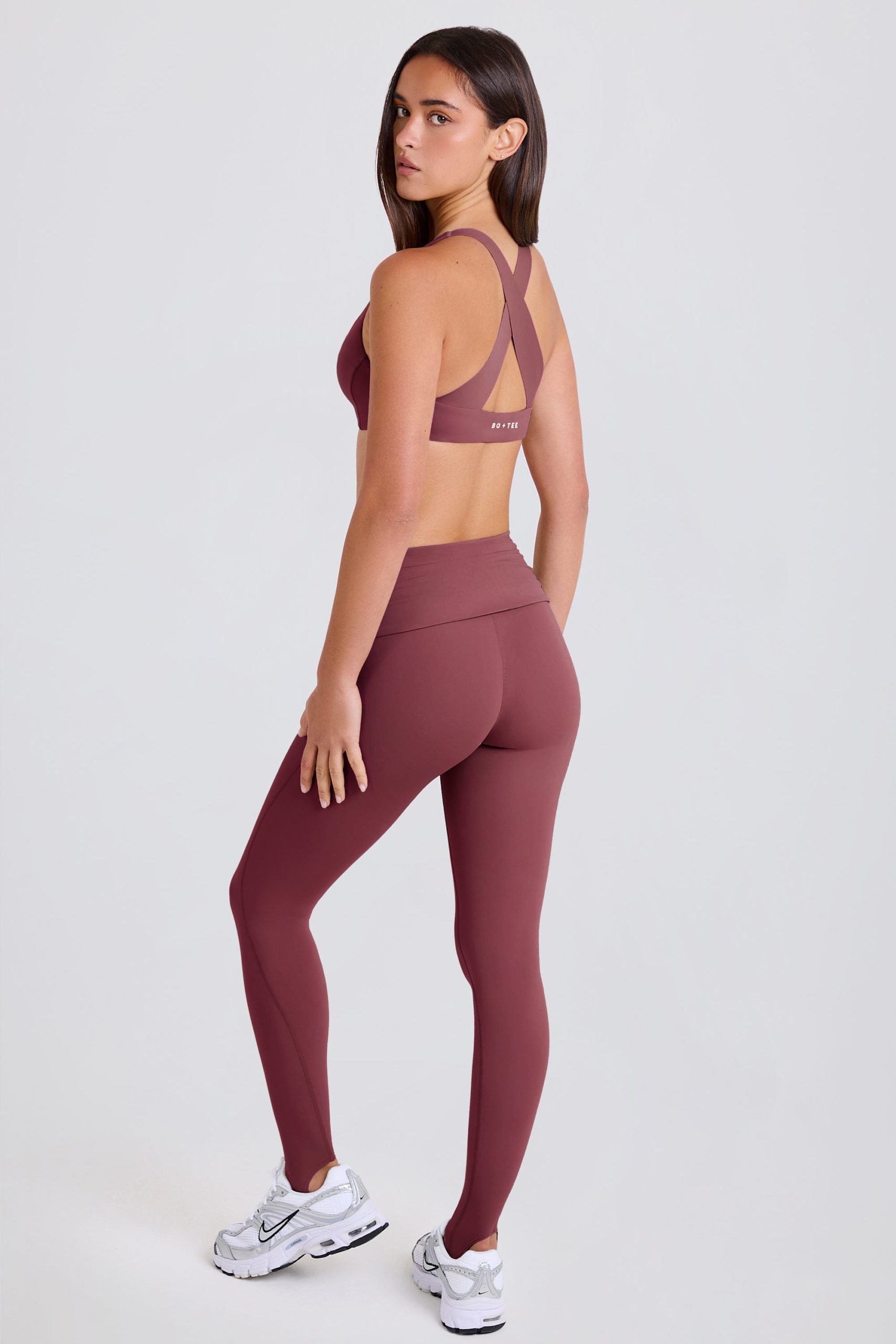 Four-Way Stretch Foldover Mid-Rise Stirrup Leggings in Acai - Image 2