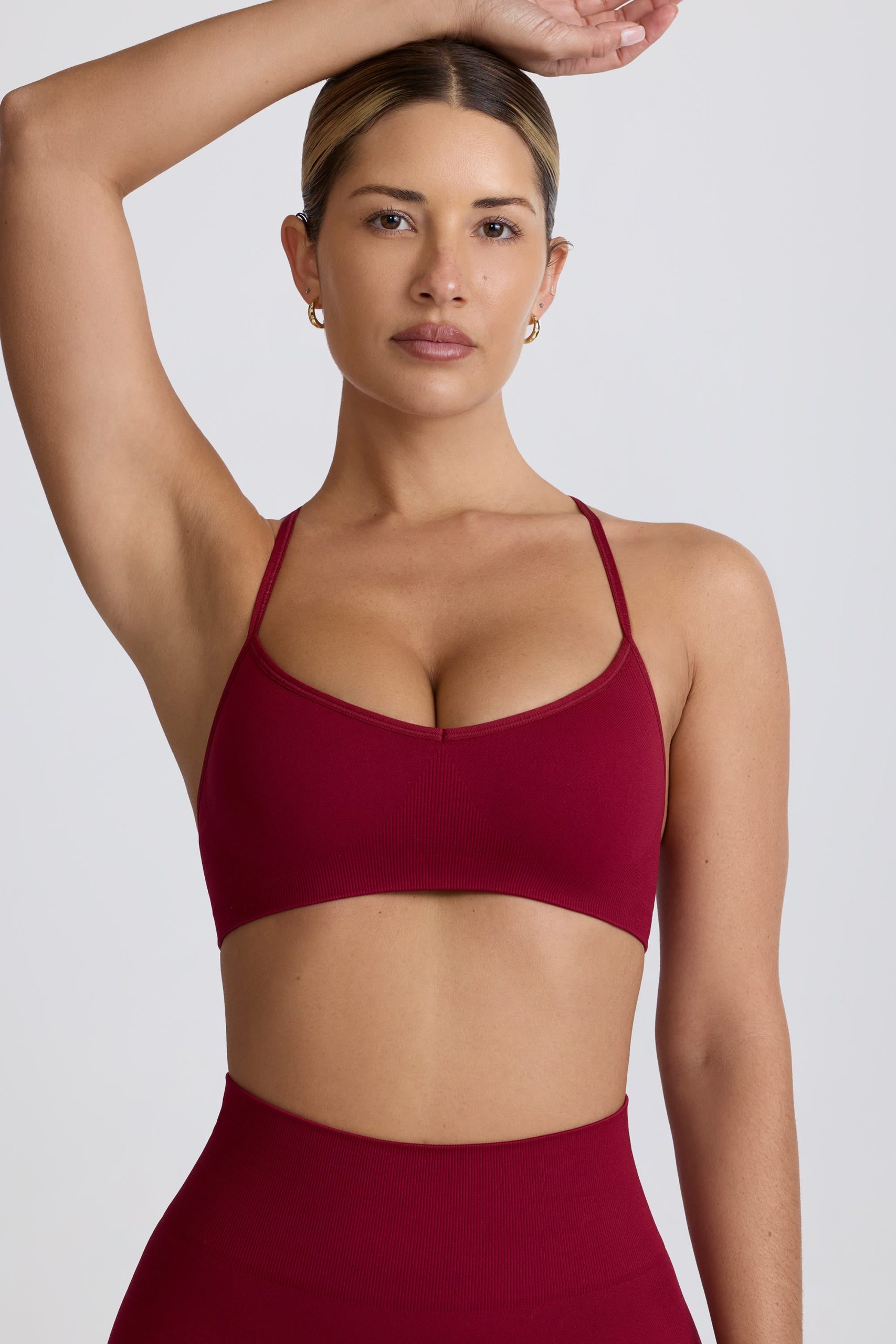 Super Sculpt Seamless Cross-Back Sports Bra in Burgundy - Image 9